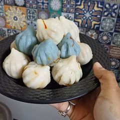 A picture of Blue Pea Cranberry Ukdiche Modak.