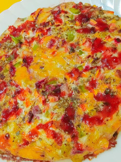 A picture of Wheat flour Tanduri sauce pizza.