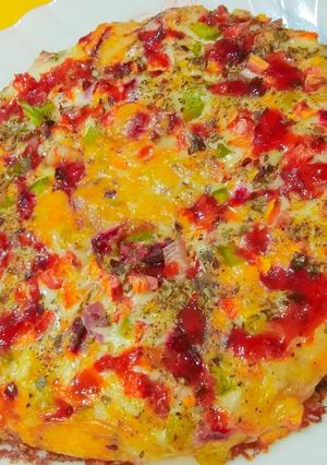 A picture of Wheat flour Tanduri sauce pizza.