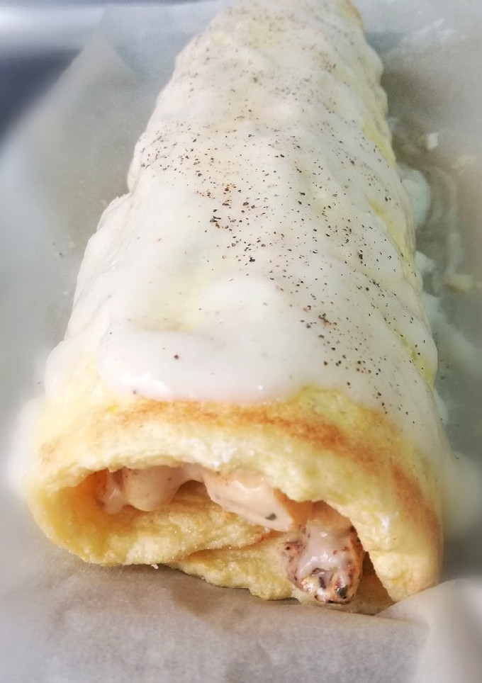 Una foto de Brazo de Gitano de Pollo Con bechamel de almendras