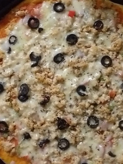 A picture of Chicken Tikka Pizza.