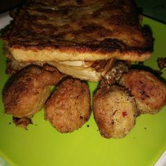 A picture of Sweetpotato balls with eggcoated bread.
