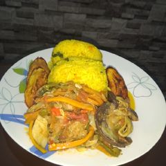 A picture of Rice and vegetable gravy.