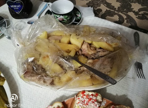 Фото Картопля з куркою в рукаві.