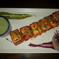 A picture of Lasanda paneer tikka with kimchi salad.