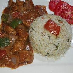 A picture of Chicken Shashlik With Gravy and Fried Rice.