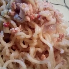 A picture of Spicy noodles with fried eggs.