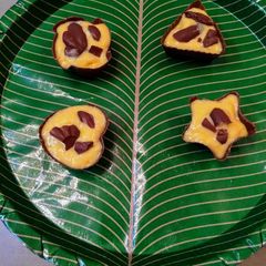 A picture of Chocolate cups with homemade mango ice cream.