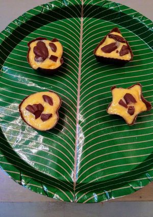 A picture of Chocolate cups with homemade mango ice cream.
