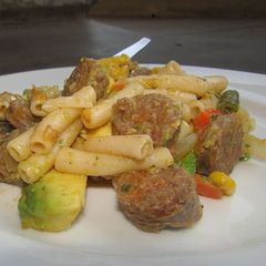 A picture of Pasta with sausage and avo.