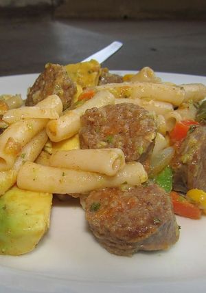 A picture of Pasta with sausage and avo.