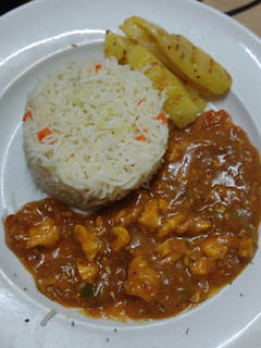 A picture of Peri peri chicken shashlik with fried rice.