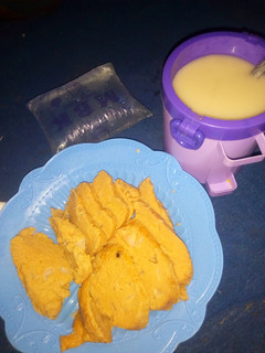 A picture of Moimoi(beans cake) and pap with water.