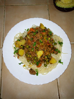 A picture of Minced meat curry with sphagetti.