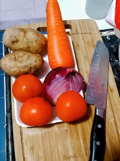 A picture of 🍅 🥕 🥔 🐟 abc soup.