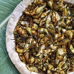 A picture of পুঠি মাছ চুঙাত দিয়া /Swam barb fish cooked in Bamboo tubes.