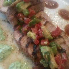 A picture of Strawberry-Chipotle Pork Chops w/ Avocado Crema & Salsa.