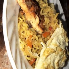 A picture of Noodles and egg with yahuza suya.
