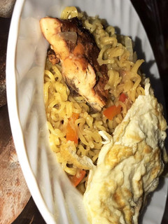 A picture of Noodles and egg with yahuza suya.