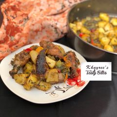 A picture of Garlic and herbs roasted potatoes and chicken.