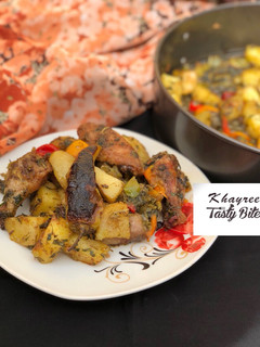 A picture of Garlic and herbs roasted potatoes and chicken.