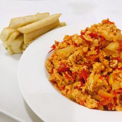 A picture of Scrambled eggs and fried yam.