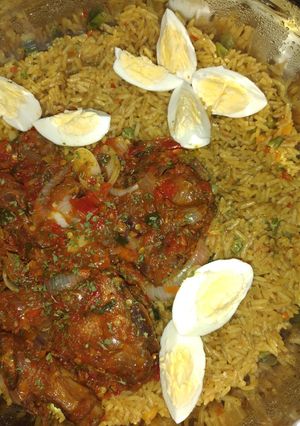 A picture of Fried rice with peppered chicken.