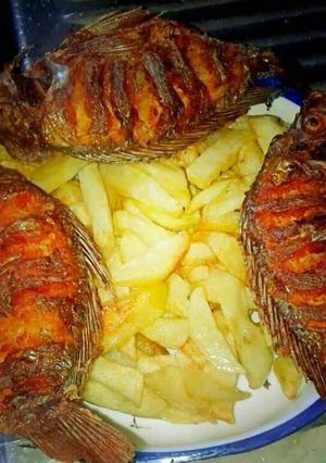 A picture of French fries and fish.