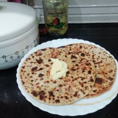 A picture of Paneer and Onion Paratha.