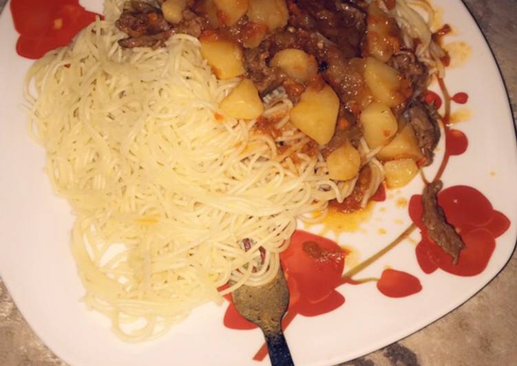 Spaghetti and shredded beef with potato soup
