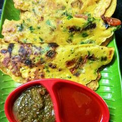 A picture of Besan chilla with vegetables.