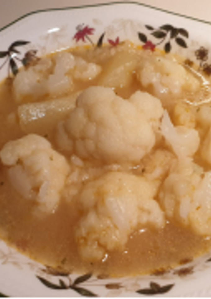 Una foto de Coliflor con patatas y arroz