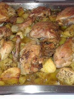 A picture of Lemon Chicken with Potatoes in the Oven.