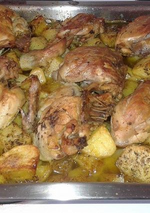 A picture of Lemon Chicken with Potatoes in the Oven.