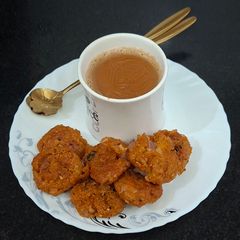 A picture of Poha Pakora / Crispy Poha Pakoda with Masala Chai for Indian Monsoon.