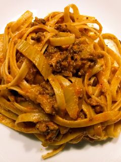 A picture of Fettuccine with beef and fennel rose sauce.
