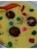 Gulab jamun floating in custard sauce
