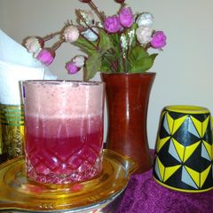 A picture of Layered grapes juice with smoothie.