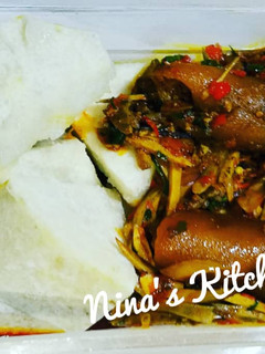 A picture of Yam with ugba sauce and pomo.