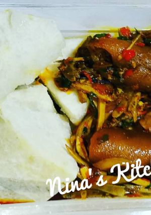 A picture of Yam with ugba sauce and pomo.