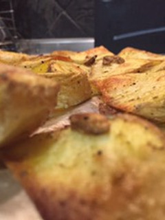 Una foto de Cuñas de patata al horno