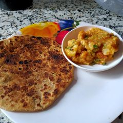 A picture of Sattu Ka paratha with Barta.