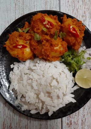 A picture of Nepali style Aloo Dum with Chiwda /Poha/ Flattened rice.