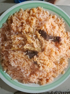 A picture of Party Jollof rice with stockfish.