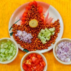 A picture of Tangy Kala chana chat / black chickpeas chat.