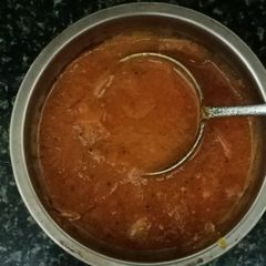 A picture of Tomato Chutney with Dosa.