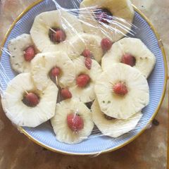 A picture of Pineapple and strawberry salad.