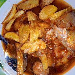 A picture of Chips and fish sauce.