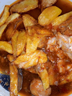 A picture of Chips and fish sauce.