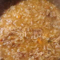 A picture of Beef rice tomato soup.